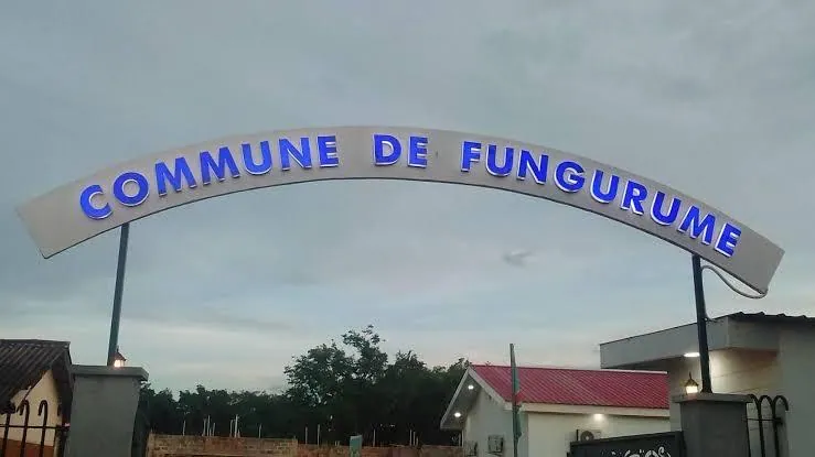 Illuminated 'Commune de Fungurume' entrance arch in Fungurume, Lualaba Province — heart of the DRC copper–cobalt belt