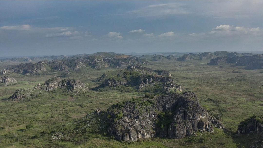 Wide landscape of limestone outcrops across the Lovo Massif