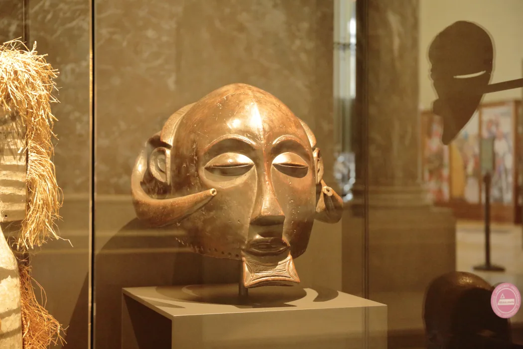 Carved Luba ceremonial mask from the Democratic Republic of Congo on museum display