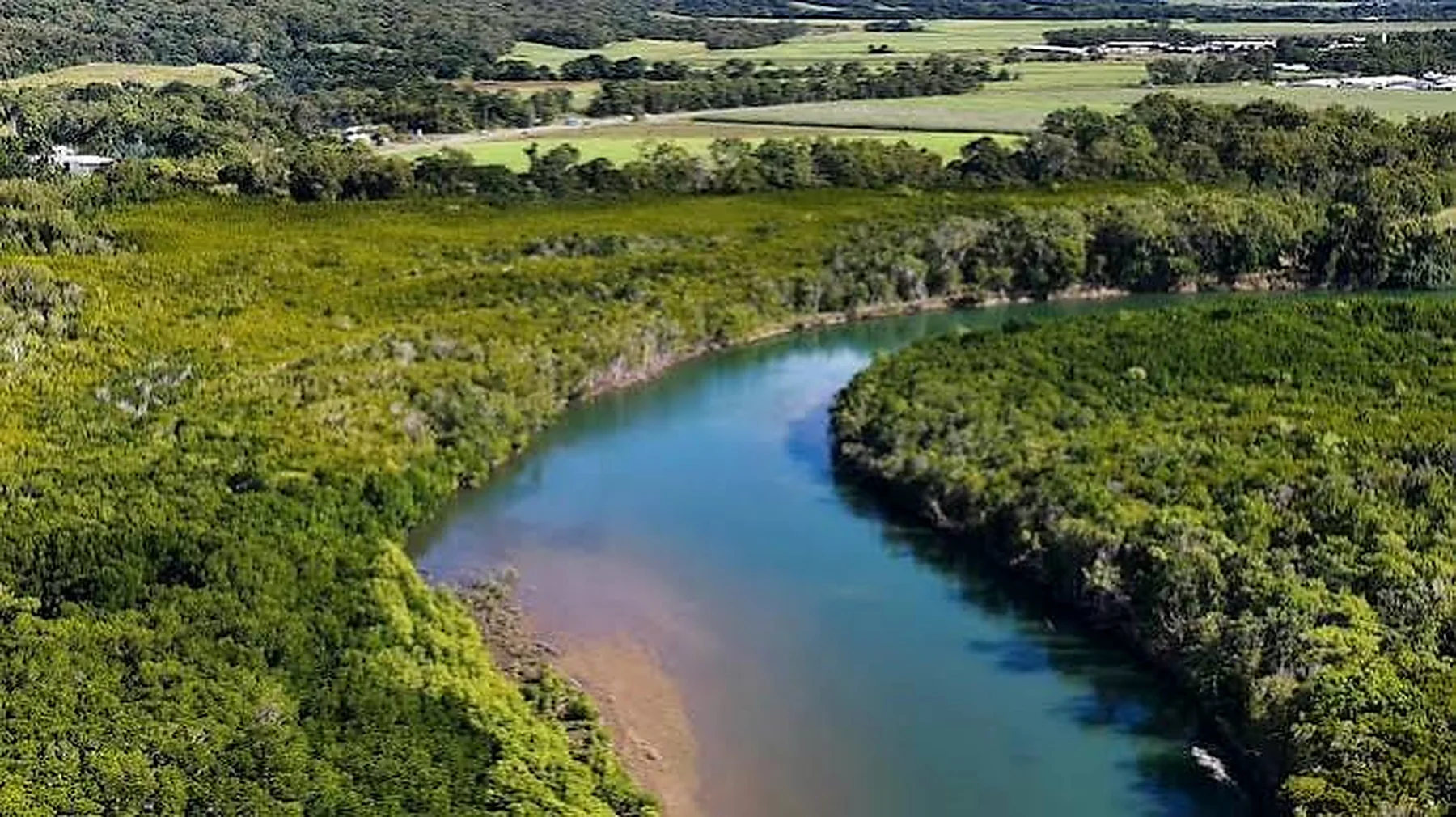 The broad Congo River winding through a green equatorial landscape