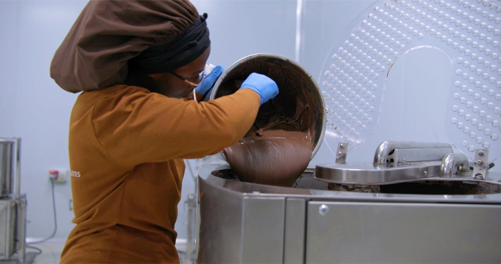 Local artisan crafting Virunga Origins chocolate from park-grown cocoa