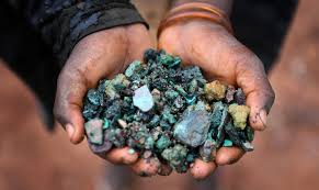 Cobalt and copper ore in hands