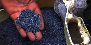 Coltan mineral in hand