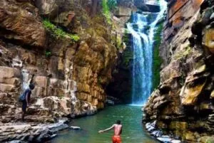 Swimming at natural waterfall gorge