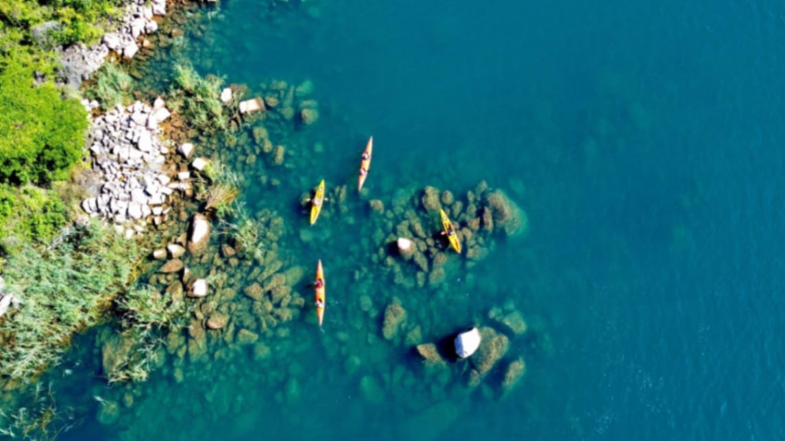 Crystal clear waters of Lake Tanganyika with kayakers