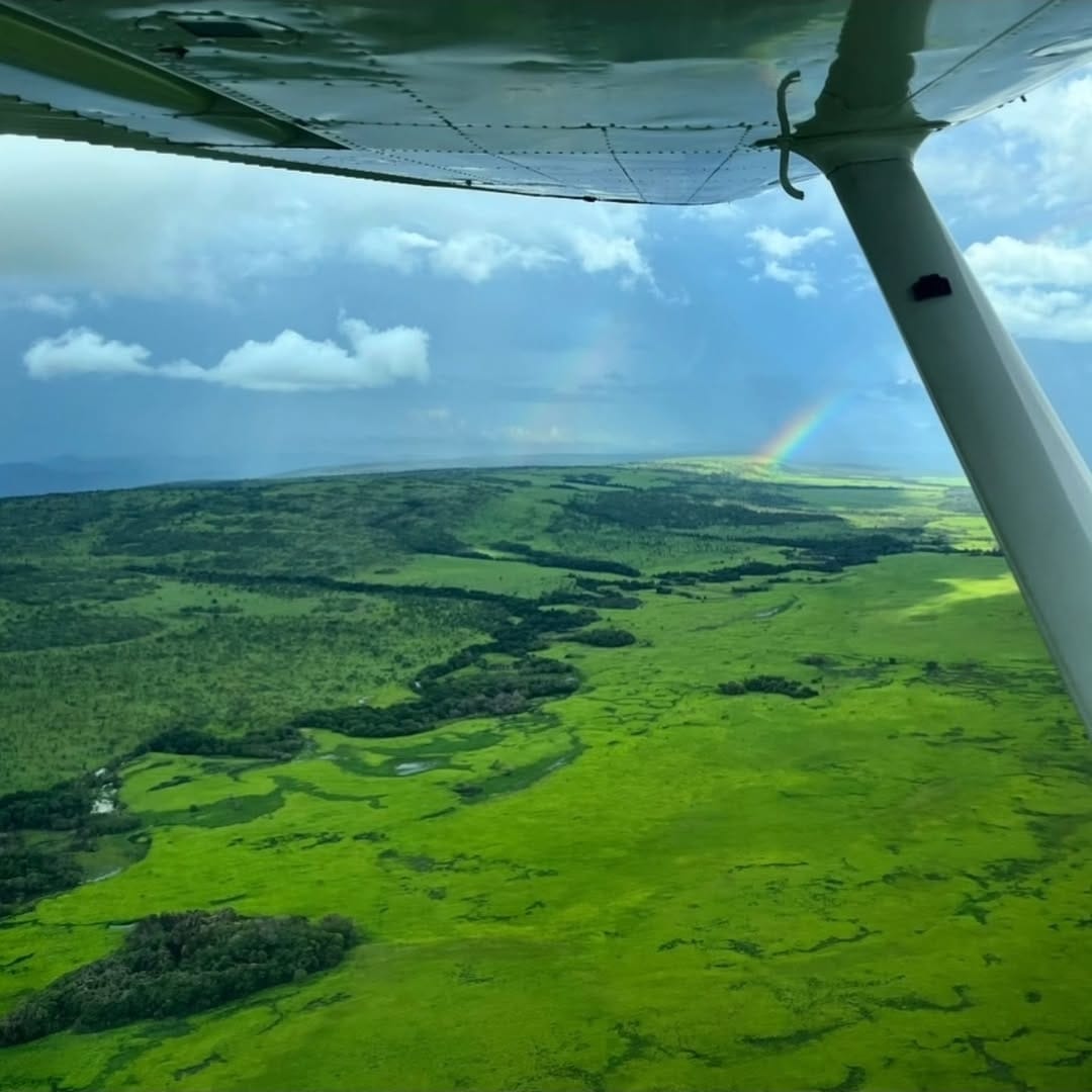 Rainbow over Upemba grasslands from the air